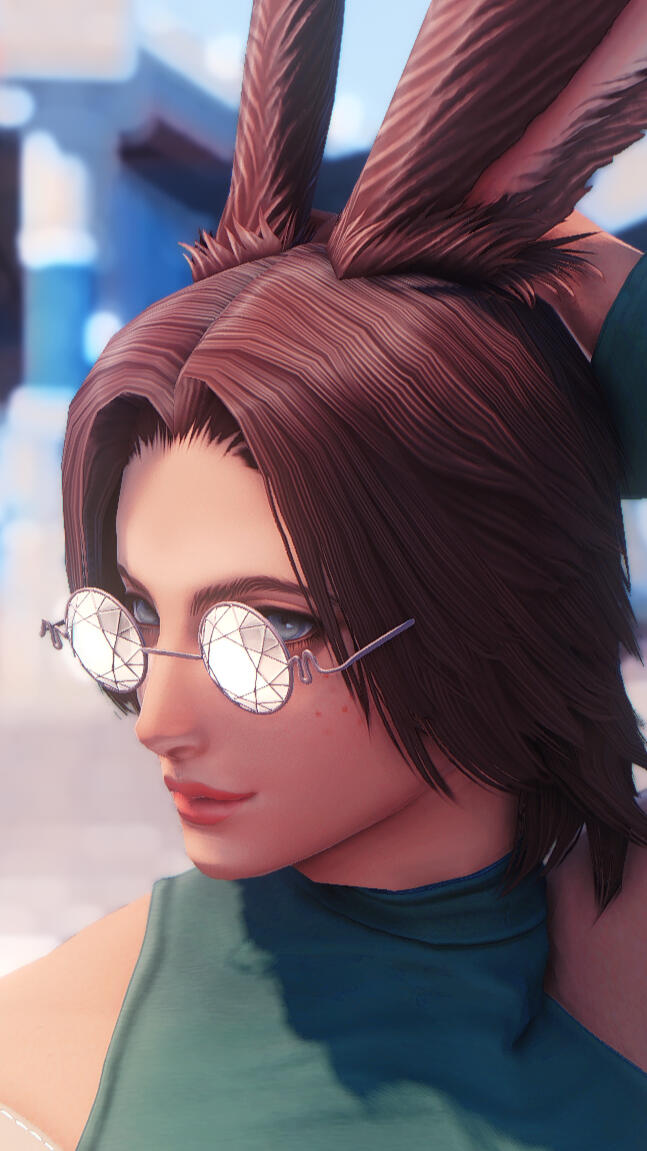 A photo of Calyx Ariti, a male viera, smiling in the distance with a white flowy top that has gold embellishments.